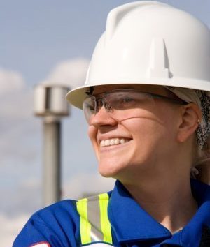 smiling worker with a white hard hat