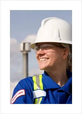 smiling worker with a white hard hat