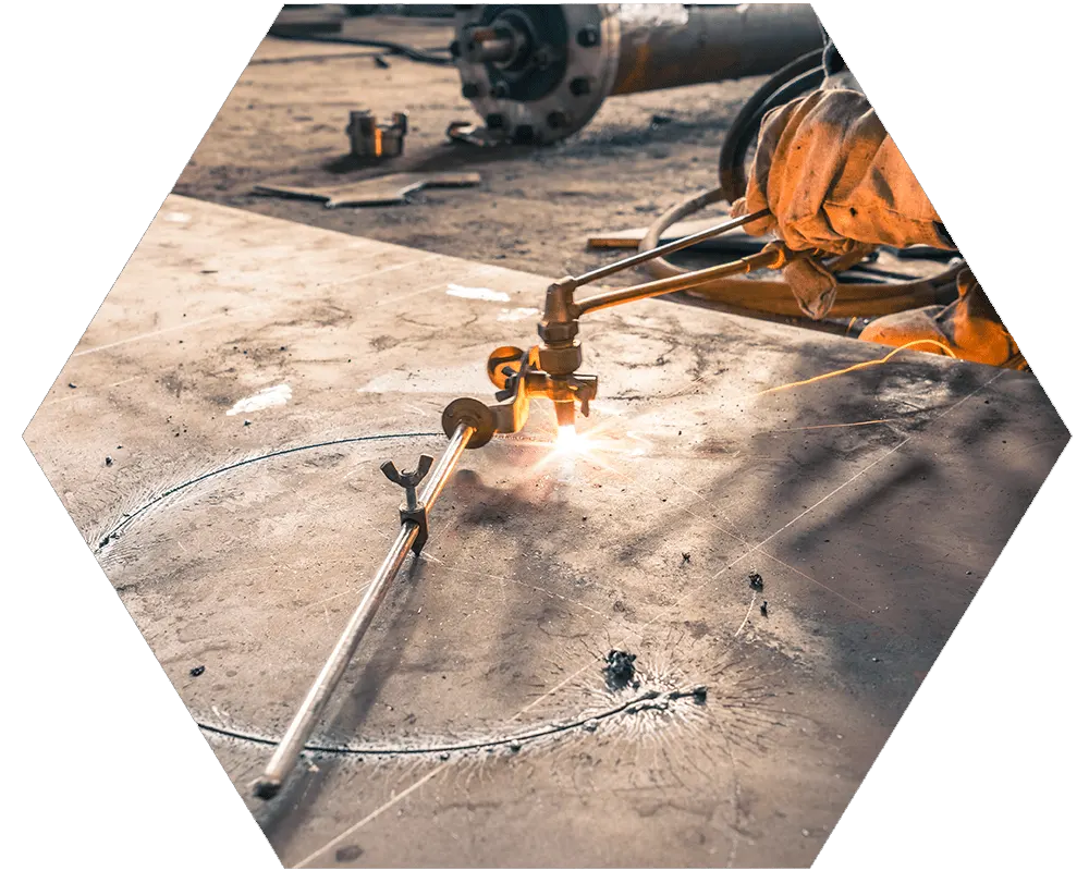 Cutting circle in sheet metal with a torch.